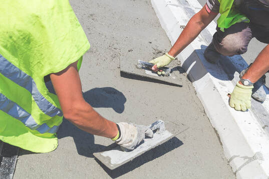 construction workers doing decorative concrete